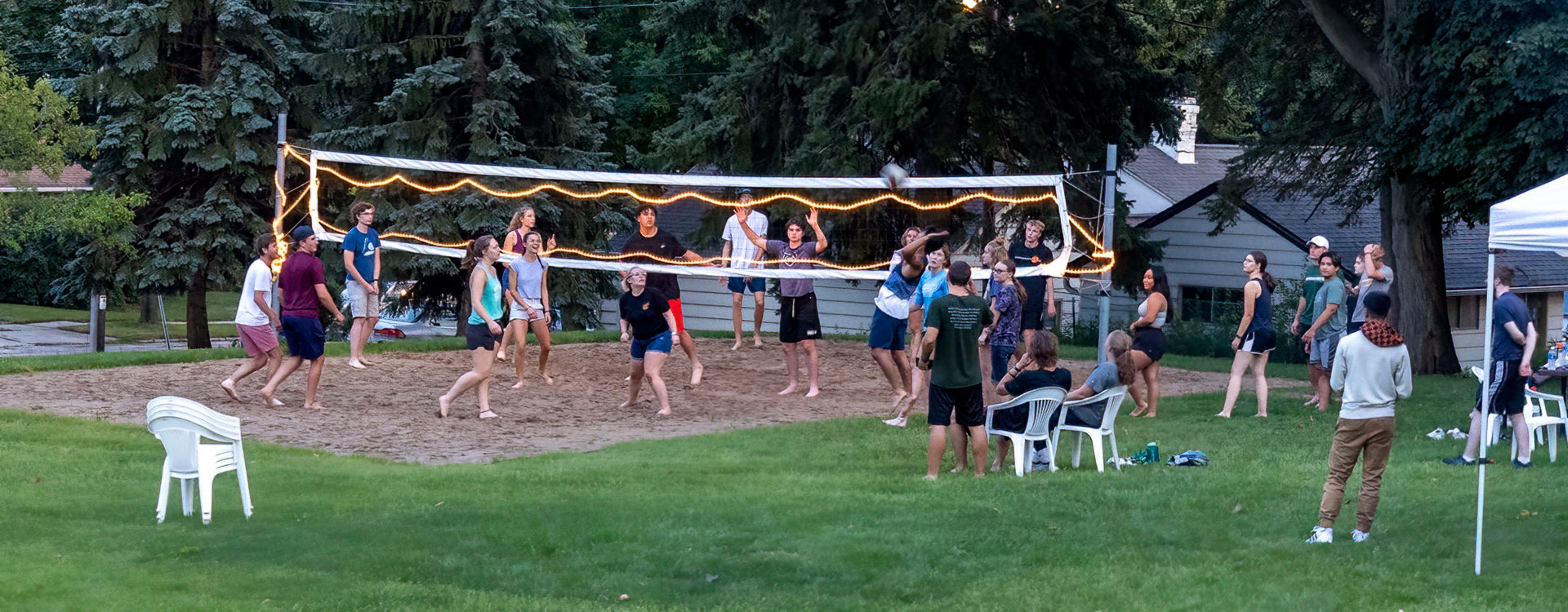 Students playing sand volleyball on WLC campus